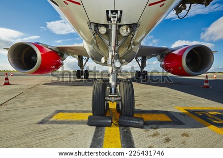 Undercarriage of the aircraft at the airport.