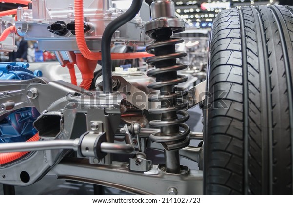 Undercarriage parts of a car, showing materials,\
wheels, shocks,\
engines