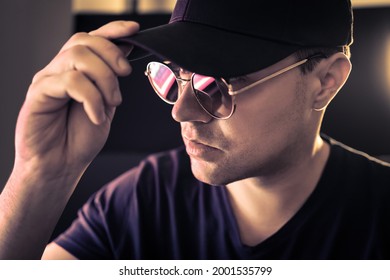 Undercover CIA Agent Or Cool Mystery Man With Glasses. Private Detective In Disguise Hiding Face Under Cap And Sunglasses. Cinematic Mysterious Concept. Police Investigator Spy. Serious Model Portrait