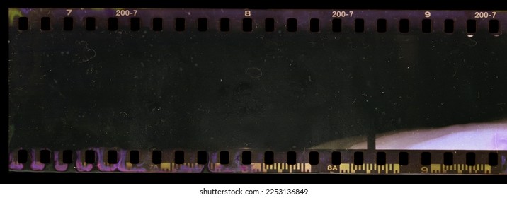 underexposed 35mm film strip on black background with smear marks, scratches and dust. - Shutterstock ID 2253136849