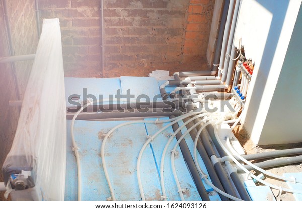 Underfloor heating system.  Installing Under floor\
Heating System