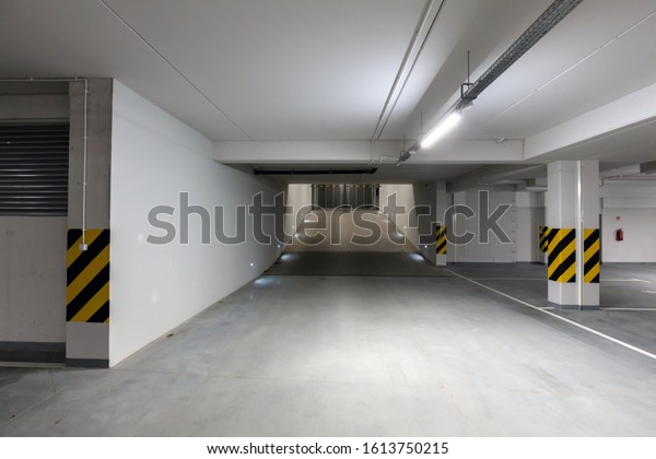 Underground empty parking garage. Gate and gateway.\
Modern urban space. Wide\
angle