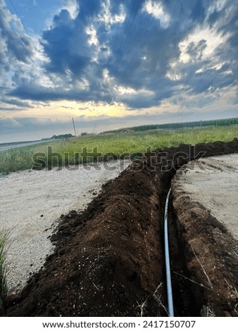Underground fiber ground work. Digging hole in ground for fiber in telecom
