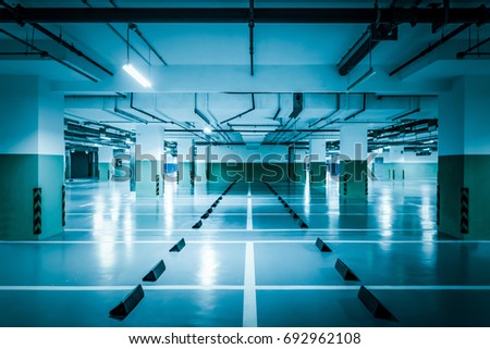 Similar – Empty multi-storey car park with yellow columns