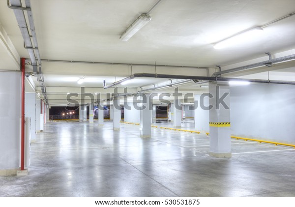 Underground\
garage. Empty underground parking\
garage