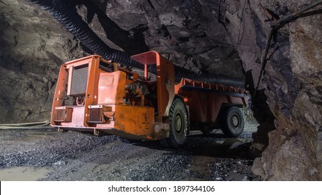 Underground gold ore mine shaft tunnel gallery passage with load, haul, dump machine LHD Toro