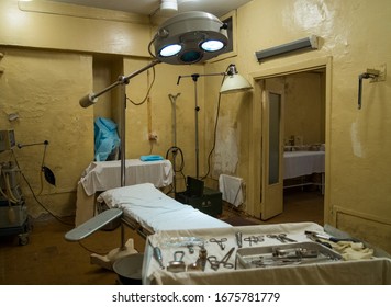 Underground hospital in the bomb shelter of the hospital. Underground operating room in case of war. The lamp for operations and a set of tools of the surgeon.