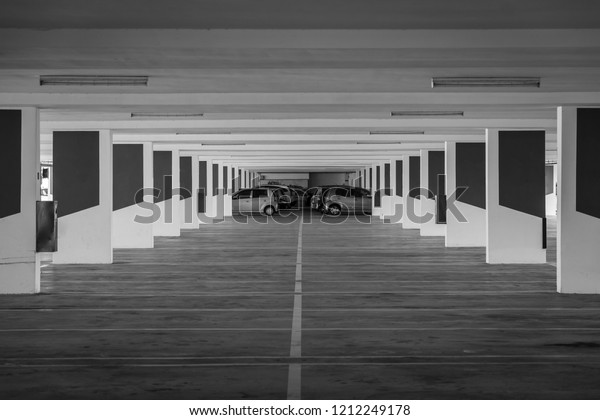 Underground parking\
area.\
Black and white\
tone.
