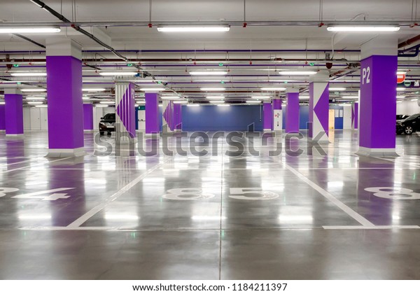 
Underground parking. An empty big underground parking.
