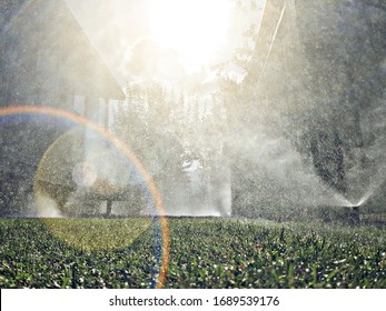Underground Sprinkler misting in Lawn. - Shutterstock ID 1689539176