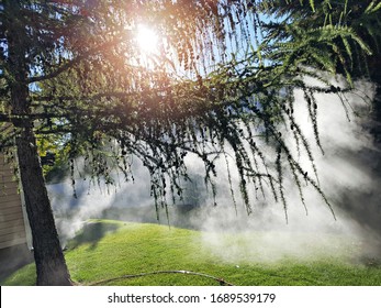 Underground Sprinkler misting in Lawn. - Shutterstock ID 1689539179
