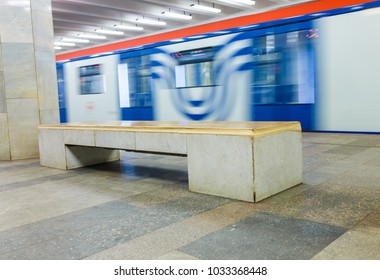 Underground Transit Empty Large Corridor Hall In Subway Station. Moving Subway Train, Motion Blurred