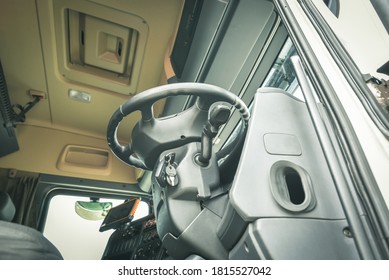 Underneath View Of Open Cab Interior Big Truck With Steering Wheel On Front