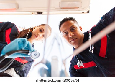 Underneath View Of Paramedic Team Giving First Aid To Patient