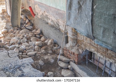 Underpinning for strengthening the foundation of an existing building - Shutterstock ID 170247116