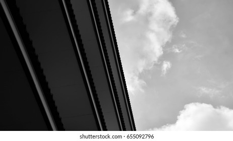 underside angle view of modern building skyscrapers roof - monochrome