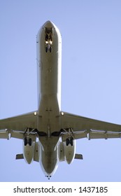 Underside of jet - very close range.  Landing gear down and approaching runway.