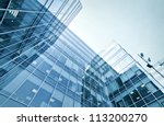 underside panoramic and perspective view to steel blue glass high rise building skyscrapers, business concept of successful industrial architecture