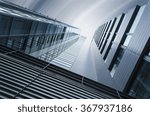 underside panoramic and perspective view to steel blue glass high rise building skyscrapers, industrial architecture
