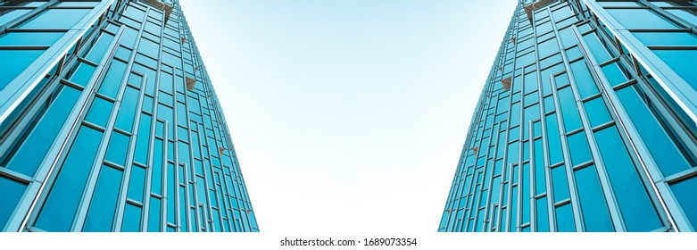 underside panoramic and perspective view to steel Tiffany blue glass high rise building skyscrapers, business concept of successful industrial architecture