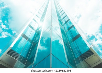 underside panoramic and perspective view to steel blue glass high rise building skyscrapers, business concept of successful industrial architecture