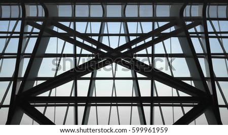 Underside view of structural glass ceiling with crossing metal girders / supporting structures. Reworked photo of modern architecture fragment.