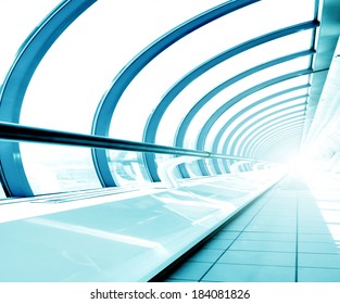 Underside wide angled and perspective view to steel blue glass airport ceiling through high rise building skyscrapers, business concept of successful industrial hallway and passageway architecture - Powered by Shutterstock