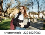 Understanding Student Loan Repayment Options. Pros and Cons of Federal vs Private Student Loans. Young student girl in glasses and with laptop and books reading letter outdoors