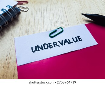 Undervalue writting on table background.
