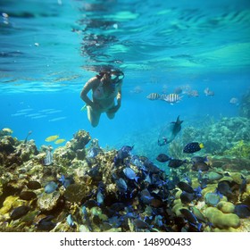 Underwater Adventure On Women Coral Reef.