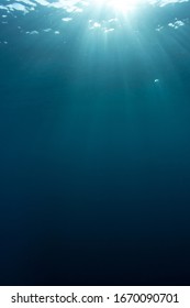 Underwater blue background and sunlight vertical photo  - Shutterstock ID 1670090701