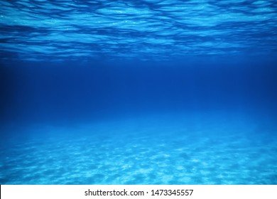 Underwater Blue Ocean, Sandy sea bottom Underwater background 