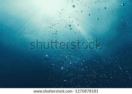 Underwater bubbles with sunlight. Underwater background bubbles.