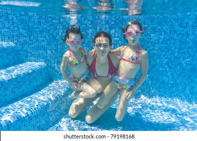 Underwater Family In Swimming Pool