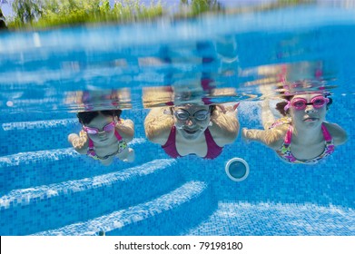 Underwater Family In Swimming Pool