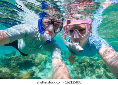 Underwater Photo Of A Couple Snorkeling In Ocean