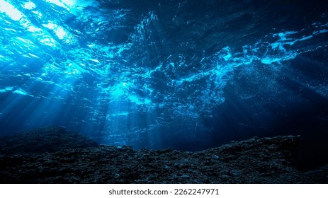 Underwater photo of rays light in the deep blue ocean. - Powered by Shutterstock