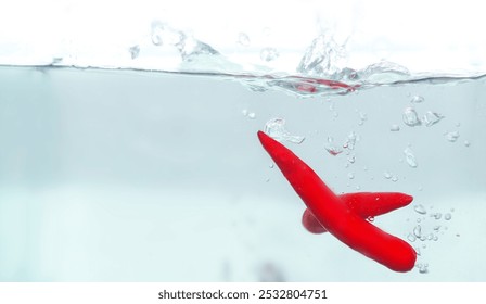 Underwater Red Chili Pepper with Air Bubbles, Abstract Concept for Freshness, Spice, and Culinary Art - Powered by Shutterstock