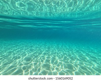Underwater Sandy Sea Bed In Tropical Exotic Turquoise Bay
