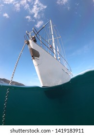 Underwater Sea Level Photo Of Sail Boat Hull Anchored In Open Ocean Sea