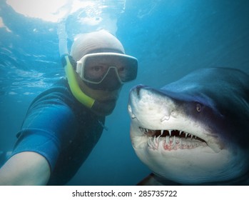 Underwater selfie with friend. Scuba diver and shark in deep sea. - Shutterstock ID 285735722