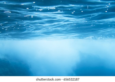 Underwater shot with sun rays and bubbles in deep
 - Shutterstock ID 656532187