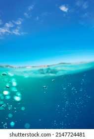 Underwater Split Images Of Pool Or Sea Water Surface And Sky