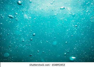 Underwater turquoise texture in ocean  Bubbles in tropical sea  