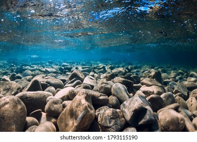 Underwater view with stones and blue transparent sea water. - Shutterstock ID 1793115190