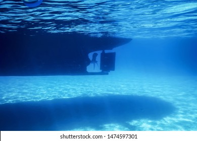 Underwater View To Yacht Rudder And Prop, Bottom Of A Boat