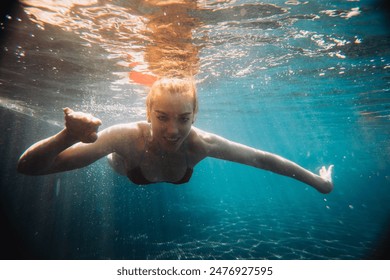 Underwater woman portrait in swimming pool.
 - Powered by Shutterstock