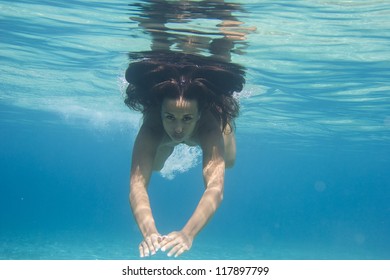 Underwater woman in the sea - Shutterstock ID 117897799