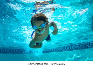 Underwater Young Boy Fun in the Swimming Pool with Goggles. Summer Vacation Fun.	 - Shutterstock ID 2224536905