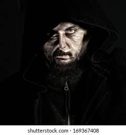 Unearthly dark portrait of mystery bearded man - double exposure